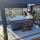 CX-6 Hot Tub installed in a garden room